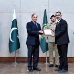 Prime Minister Muhammad Shehbaz Sharif distributing appreciation certificates among the staff of the PM House and PM Office