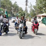 Motorcyclists with Pakistani flags are enjoying the bike ride on the occasion of 77th Independence Day celebration