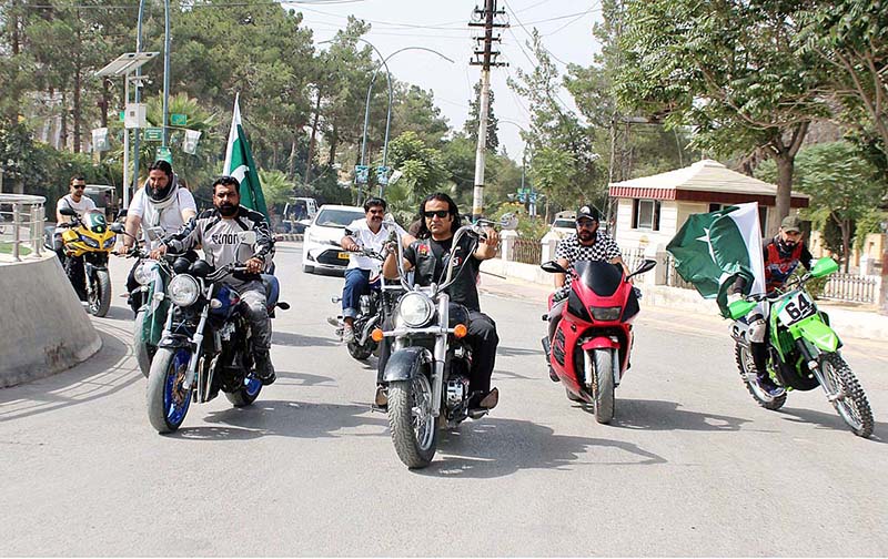 Motorcyclists with Pakistani flags are enjoying the bike ride on the occasion of 77th Independence Day celebration