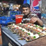 A vendor preparing paan at Lakshmi Chowk