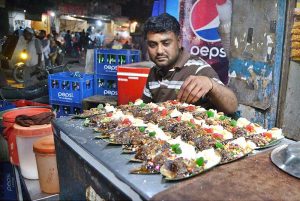 A vendor preparing paan at Lakshmi Chowk