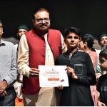 Artist Mohsin Gillani giving the certificates to the Arts students after completing one month workshop and performing on the stage during a Theater play titled (Apne Madad Aap) Directed by Rukhsana Khan and written by Syed Zeeshan in collaboration with Lahore Arts Council at Al-Hamra