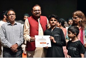 Artist Mohsin Gillani giving the certificates to the Arts students after completing one month workshop and performing on the stage during a Theater play titled (Apne Madad Aap) Directed by Rukhsana Khan and written by Syed Zeeshan in collaboration with Lahore Arts Council at Al-Hamra
