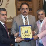 President Chamber of Commerce Abdul Ghafor Malik presenting a shield to Dr Farid Iqbal Qureshi Secretary Trade Development Authority Pakistan at SCCI