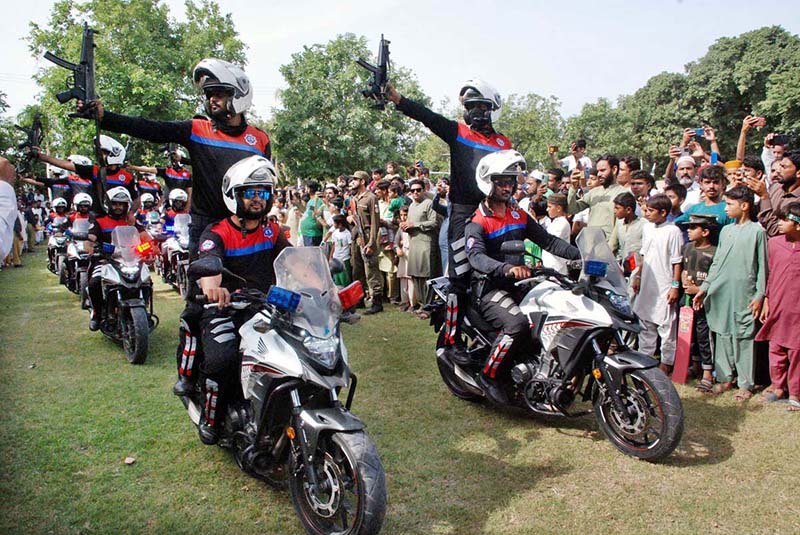 Motorcyclists with Pakistani flags are enjoying the bike ride on the occasion of 77th Independence Day celebration