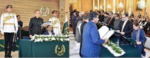 President Dr. Arif Alvi administering the oath of office to members of the caretaker Federal Cabinet, at Aiwan-e-Sadr