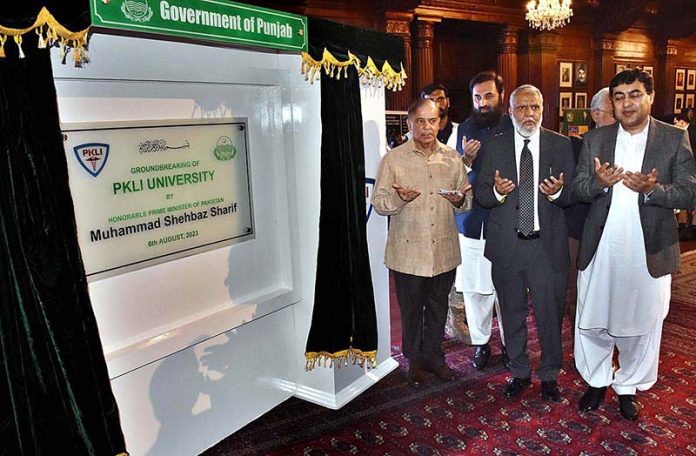 Prime Minister Muhammad Shehbaz Sharif offering dua after unveiling plaque during the groundbreaking ceremony of PKLI University and Launching of the National Hepatitis C Elimination Campaign