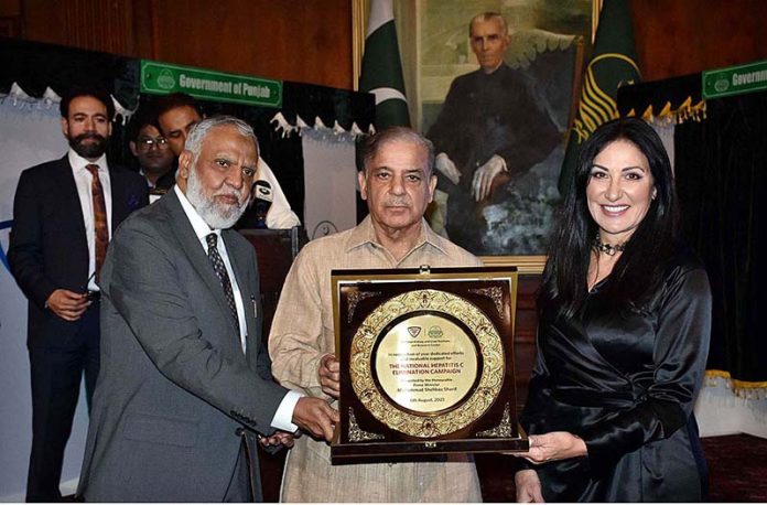 Prime Minister Muhammad Shehbaz Sharif giving the best performance shields to the Staff members of PKLI and Health professionals during the groundbreaking ceremony of PKLI University and Launching of the National Hepatitis C Elimination Campaign