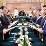 President Dr. Arif Alvi administering the oath of office to members of the caretaker Federal Cabinet, at Aiwan-e-Sadr
