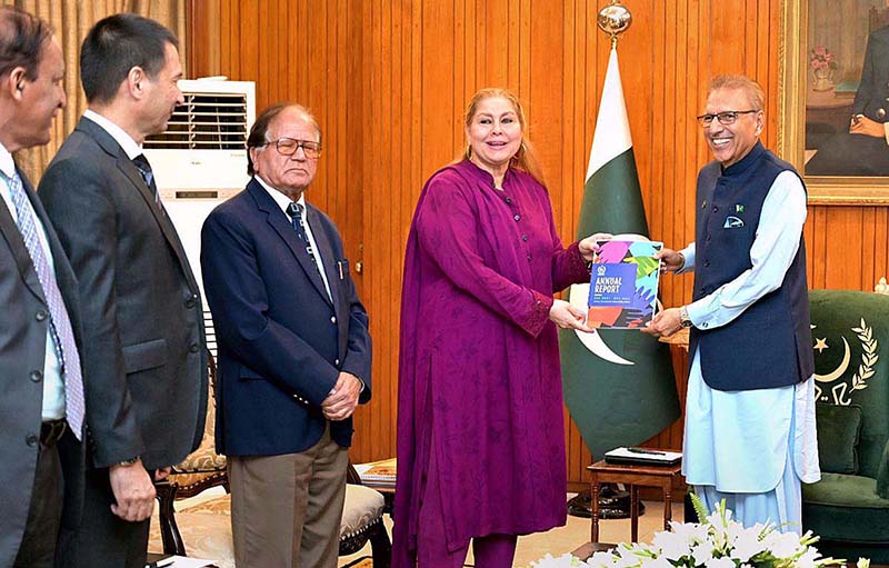 Chairperson National Commission for Human Rights (NCHR), Ms. Rabiya Javeri Agha, presents the Annual Report of NHCR for year 2021-22 to President Dr. Arif Alvi, at Aiwan-e-Sadr