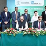 Principal Information Officer Mobashir Hassan and Executive Director of State Life Insurance Corporation Shahid Iqbal Baloch signing an agreement for the provision of health insurance to working journalists and media workers associated with the media houses of Pakistan. Prime Minister Muhammad Shehbaz Sharif and Information Minister Ms Marriyum Aurangzeb witnessing the ceremony