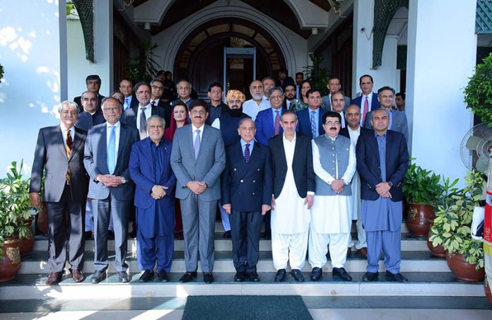 Prime Minister Muhammad Shehbaz Sharif in a group photo with members and special invitees of the 50th meeting of the Council of Common Interests