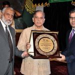 Prime Minister Muhammad Shehbaz Sharif giving the best performance shields to the Staff members of PKLI and Health professionals during the groundbreaking ceremony of PKLI University and Launching of the National Hepatitis C Elimination Campaign