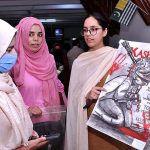 Students keenly viewing paintings during an exhibition titled “Kashmir conflict through Art" organized by Department of Islamic Art and Architecture, International Islamic University Islamabad and Youth Forum for Kashmir in connection with Kashmir Siege Day to commemorate and show solidarity with our Kashmiri brother and sisters
