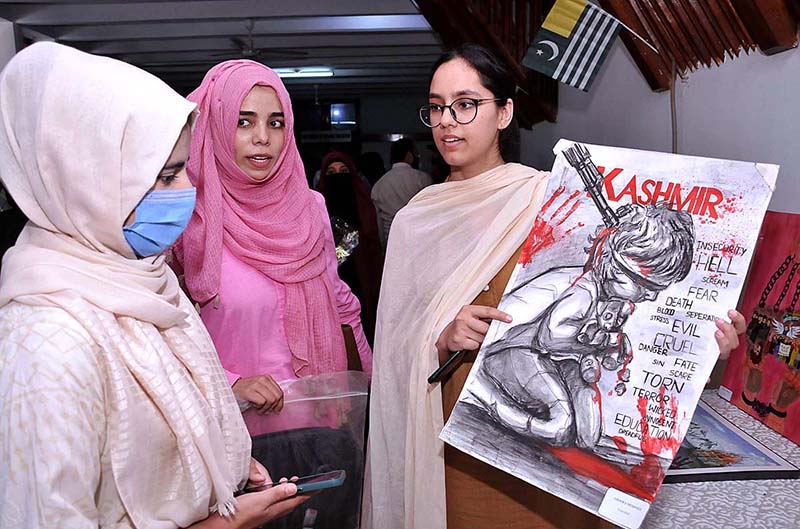 Students keenly viewing paintings during an exhibition titled “Kashmir conflict through Art" organized by Department of Islamic Art and Architecture, International Islamic University Islamabad and Youth Forum for Kashmir in connection with Kashmir Siege Day to commemorate and show solidarity with our Kashmiri brother and sisters