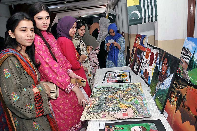Students keenly viewing paintings during an exhibition titled “Kashmir conflict through Art" organized by Department of Islamic Art and Architecture, International Islamic University Islamabad and Youth Forum for Kashmir in connection with Kashmir Siege Day to commemorate and show solidarity with our Kashmiri brother and sisters
