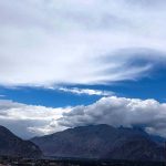 An attractive and eye catching view of thick clouds hovering over the sky of the city
