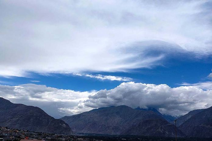 An attractive and eye catching view of thick clouds hovering over the sky of the city