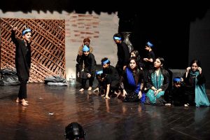 Participants of the training workshop students performing on the stage during a Theater play titled (Apne Madad Aap) directed by Rukhsana Khan and written by Syed Zeeshan in collaboration with Lahore Arts Council at Al-Hamra