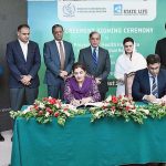 Director General, Directorate of Electronic Media Publications Ms. Samina Farzin and Divisional Head of State Life Insurance Corporation Mr. Muhammad Ashar signing MoU for provision of health insurance to artists and technicians associated with Pakistan's film industry. Prime Minister Shehbaz Sharif and Information Minister Ms Marriyum Aurangzeb witnessing the ceremony