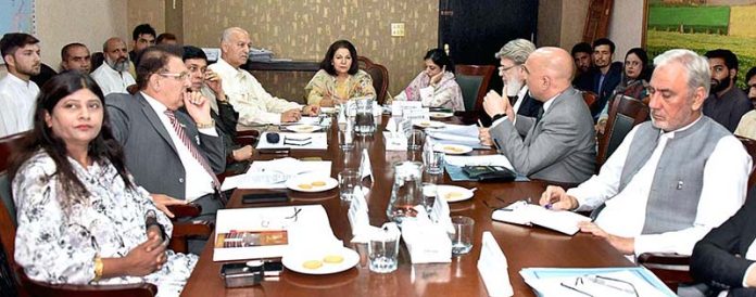Senator Seemee Ezdi, Chairperson Senate Standing Committee on Climate Change presiding over a meeting of the committee at Parliament House