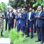 Caretaker Prime Minister Anwaar-ul-Haq Kakar offering dua after planting a sapling during his visit to the Ministry of Foreign Affairs