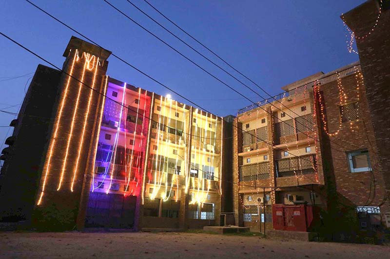 An illuminated view of district Secretariat Shahbaz building decorated with colorful lights in preparations to celebrate Independence Day in befitting manners