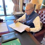 President Dr. Arif Alvi signing the summary to approve the appointment of Mr. Anwar-ul-Haq as the caretaker Prime Minister under Article 224(1A) of the Constitution, at Aiwan-e-Sadr