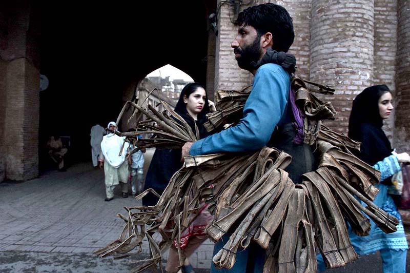 A vendor selling peel of tree (Dandasa) near Dehli Gate, it is used as the traditional teeth cleaner