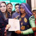 Federal Minister for Poverty Alleviation and Social Safety & Chairperson, Benazir Income Support Programme Ms. Shazia Marri distributing ownership (Sanad) of houses built by Sindh Government to the deserving people during the ceremony “Distribution of Land Title to Flood Affectees