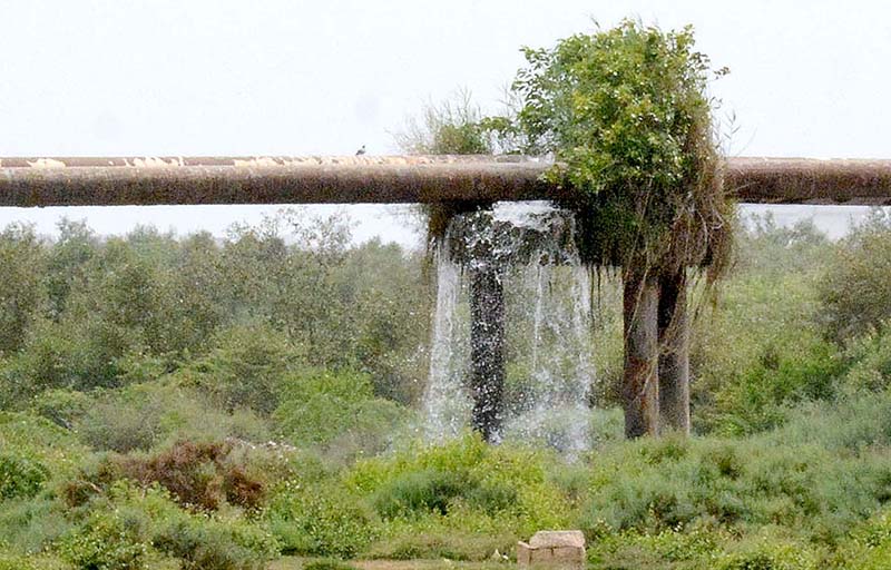A damaged water pipeline crossing over Korangi River needs the attention of the concerned authorites