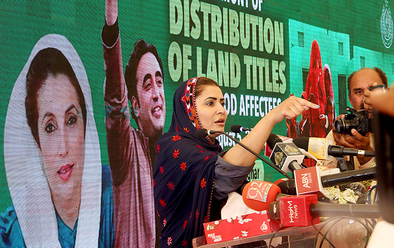 Federal Minister for Poverty Alleviation and Social Safety & Chairperson, Benazir Income Support Programme Ms. Shazia Marri distributing ownership (Sanad) of houses built by Sindh Government to the deserving people during the ceremony “Distribution of Land Title to Flood Affectees