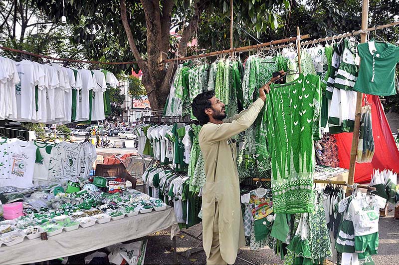 Vendors displaying National flags at G-9 Markaz to attract the customers as the nation starts preparations to celebrate Independence Day in befitting manners