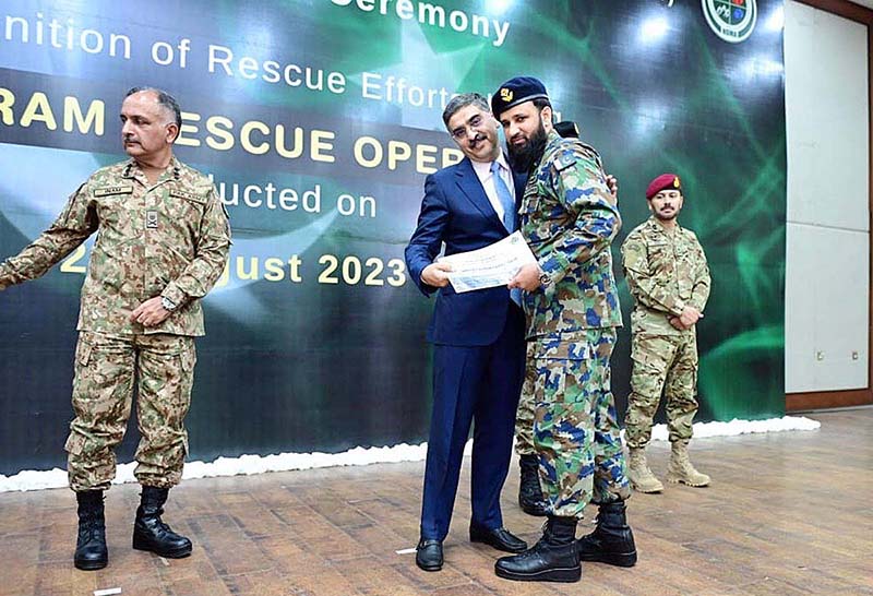 Caretaker Prime Minister Anwaar-ul-Haq Kakar awarding appreciation certificates to the rescuers of Battagram chairlift incident at a ceremony in Prime Minister's Office