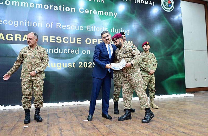 Caretaker Prime Minister Anwaar-ul-Haq Kakar awarding appreciation certificates to the rescuers of Battagram chairlift incident at a ceremony in Prime Minister's Office