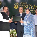 Federal Interior Minister Rana Sana Ullah Khan is distributing laptops among University students during the laptop distribution ceremony in University of Agriculture Faisalabad (UAF)
