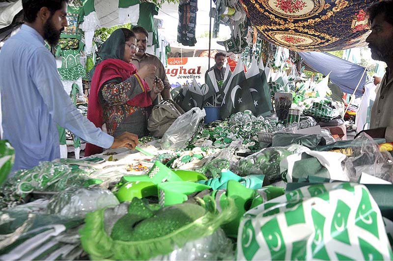 Vendors displaying National flags at G-9 Markaz to attract the customers as the nation starts preparations to celebrate Independence Day in befitting manners