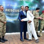 Caretaker Prime Minister Anwaar-ul-Haq Kakar distributing awards among the survivors of Battagram chairlift incident for their bravery at a ceremony