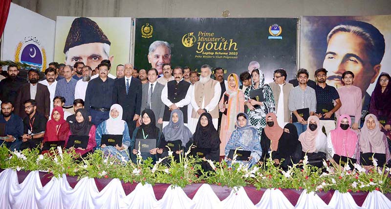 Federal Interior Minister Rana Sana Ullah Khan is distributing laptops among University students during the laptop distribution ceremony in University of Agriculture Faisalabad (UAF)
