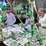 A vendor displaying national flag and other stuff to attract the customers in connection with upcoming Independence Day celebrations