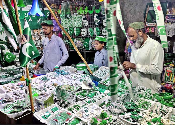 A vendor displaying national flag and other stuff to attract the customers in connection with upcoming Independence Day celebrations