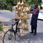 A shopkeeper displays bird's nests on his bicycle to attract customers