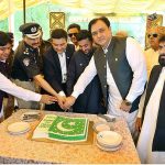 Commissioner Bilal Ahmed Memon along with DIG Pir Muhammad Shah and Mayer Kashif Shoro is cutting the cake during Flag hoisting ceremony at Circuit House on the occasion of 77th Independence Day celebration