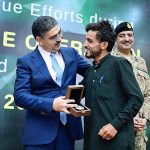 Caretaker Prime Minister Anwaar-ul-Haq Kakar distributing awards among the survivors of Battagram chairlift incident for their bravery at a ceremony
