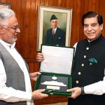 Speaker National Assembly Raja Pervez Ashraf presenting souvenir to Member National Assembly Ghous Bux Mahar at Parliament House