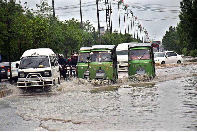 WASA staff working to restore the sewerage system near Kalma Chowk