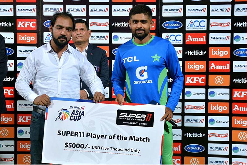 Pakistan’s, Babar Azam receives Player of the Match as he made 151 runs during the first cricket match of the Asia Cup 2023 between Pakistan and Nepal at Multan Cricket Stadium. APP/QSM/ABB