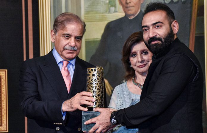 Prime Minister Shahbaz Sharif distributing award among the best performing Actors, Producers and Directors from Pakistan's Film Industry Prime Minister Shahbaz Sharif distributing award among the best performing Actors, Producers and Directors from Pakistan's Film Industry