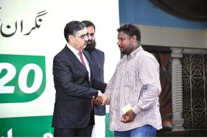 Caretaker Prime Minister Anwaar-ul-Haq Kakar distributes cheques of 2 million rupees each to individuals from the Christian community whose residences were damaged due to mob violence in Tehsil Jaranwala