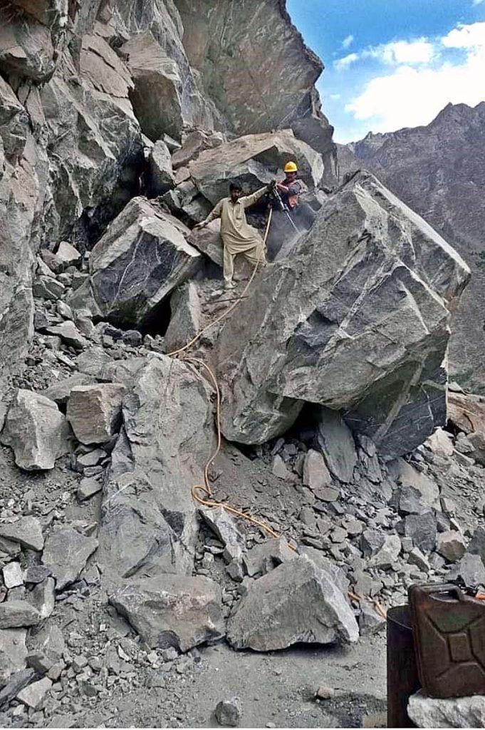FWO workers busy in clearing block area of Juglote-Skardu road after land sliding during rain in city